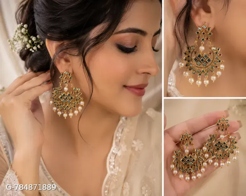 This classic multi-color Jhumka set with maang tika features gold-plated alloy construction adorned with mirror work and vibrant beaded drop