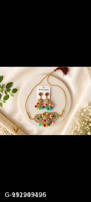 This gold-plated Kundan choker set features multicolored beads and artificial stones, resembling traditional Indian bridal jewelry